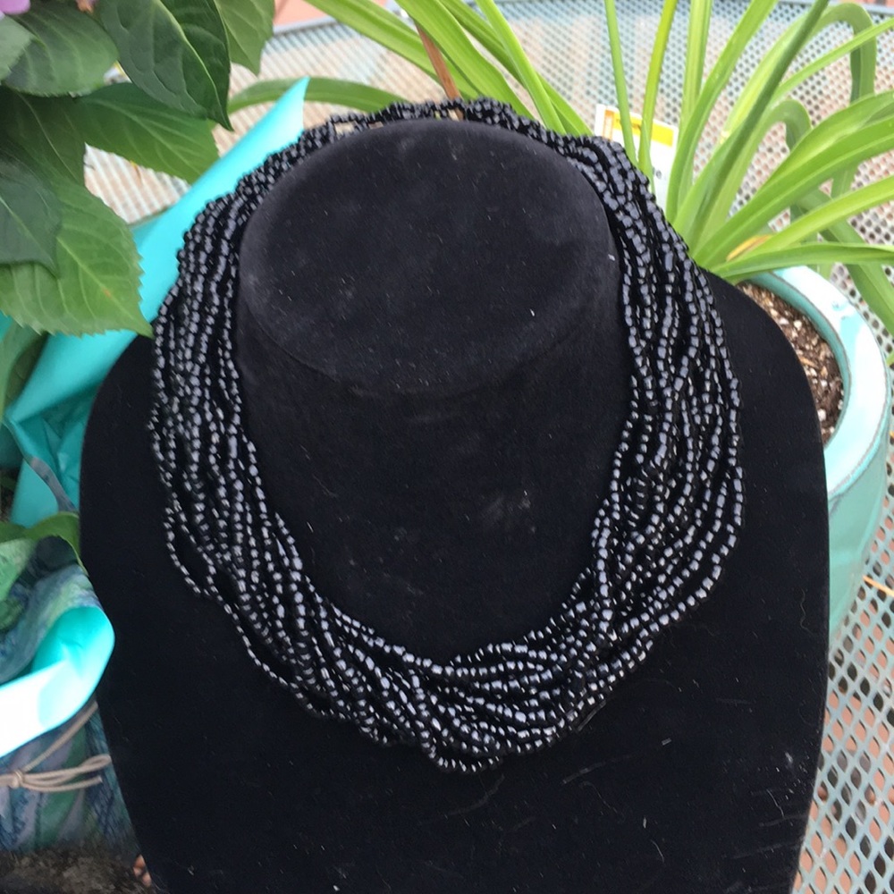 Black multi bead multi strand necklace.